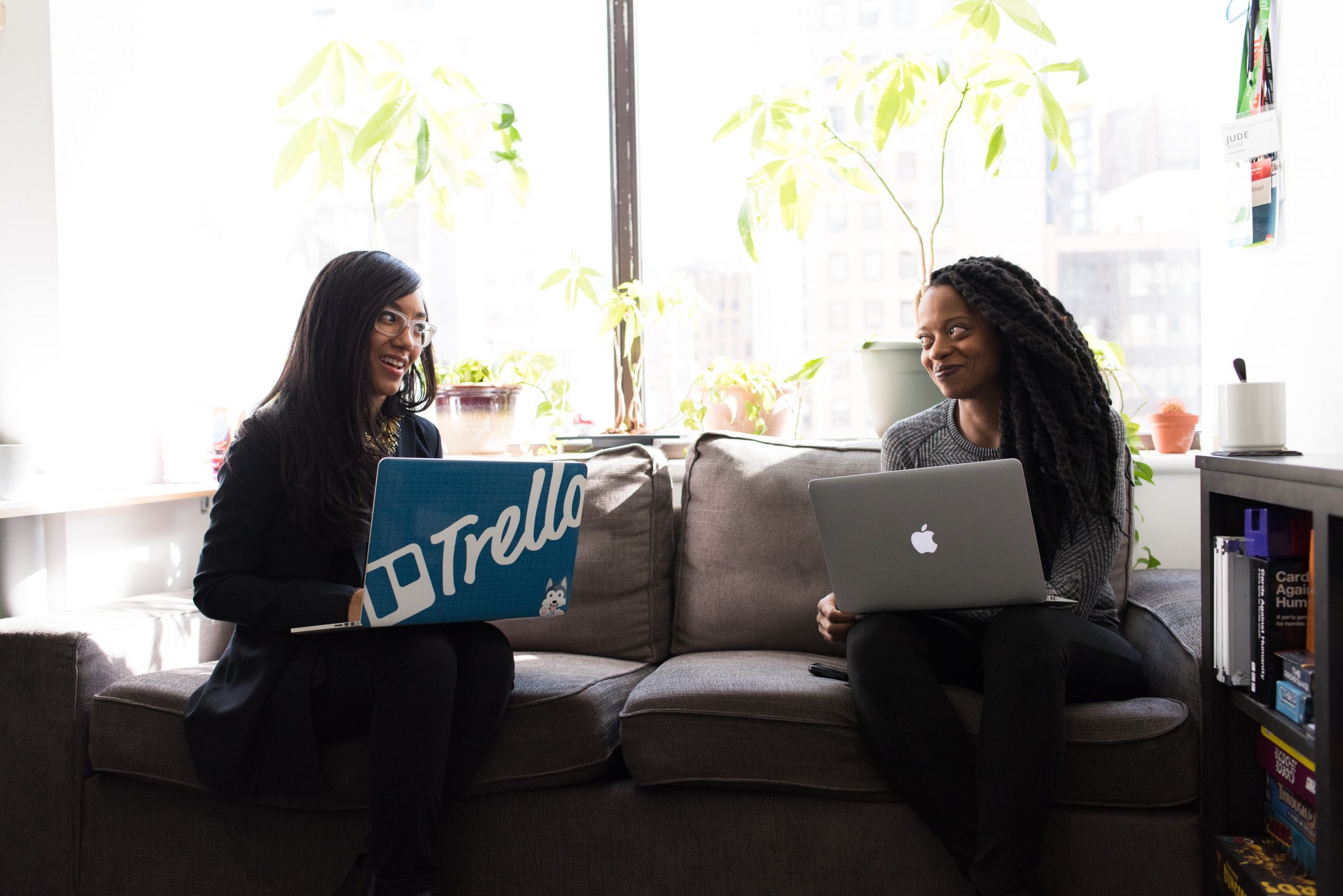 two women on laptops