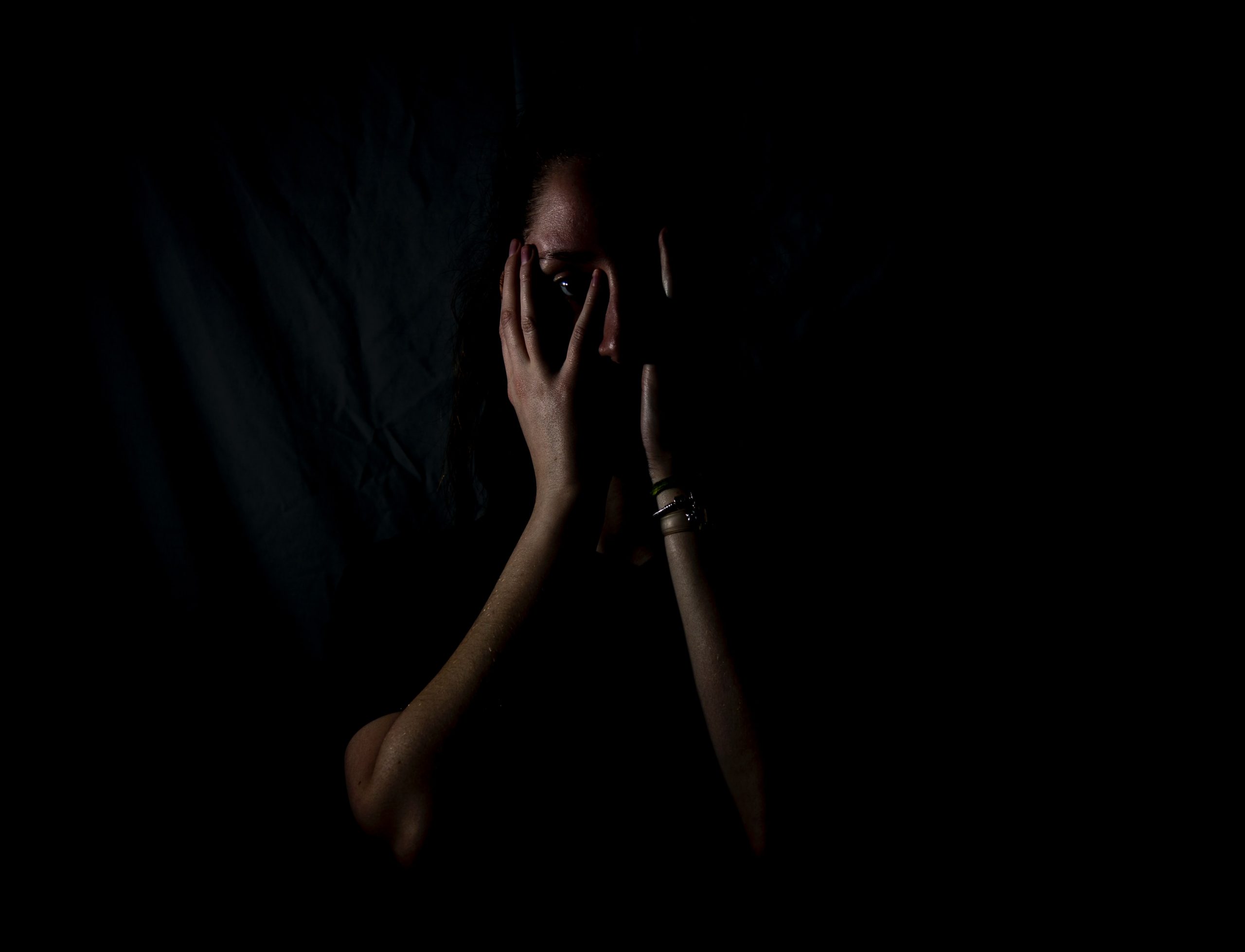 woman hiding her face