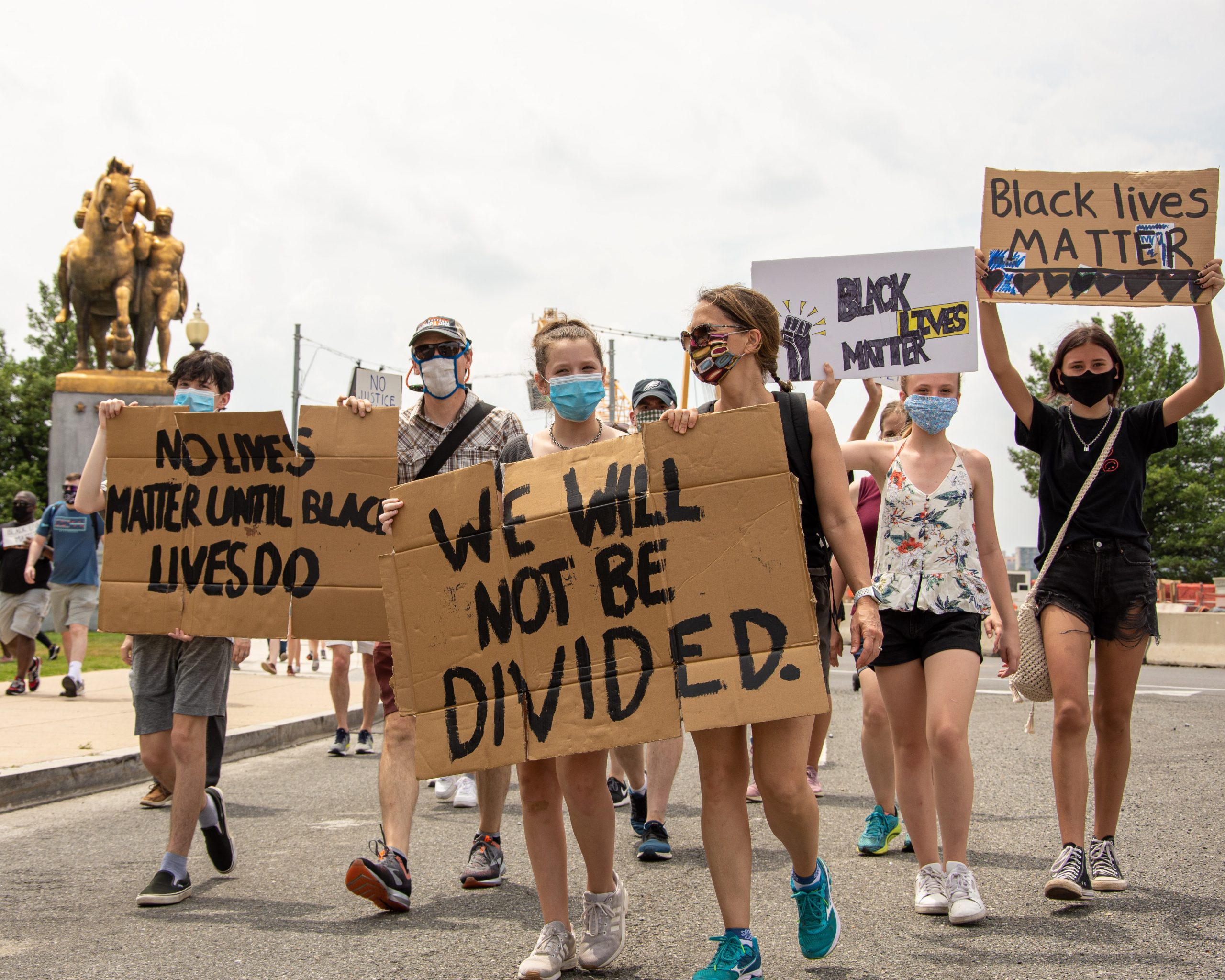 young girls holding signs